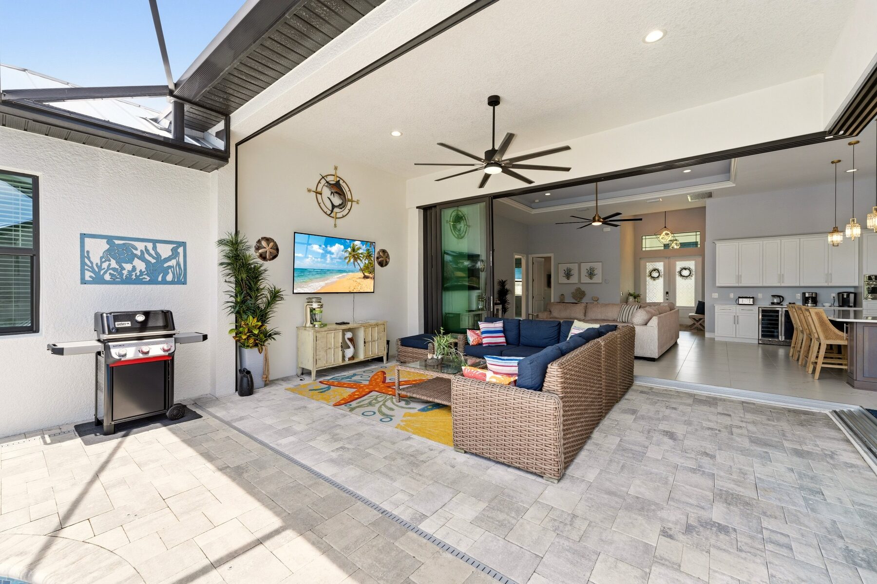 Covered lanai opening into the living room and kitchen
