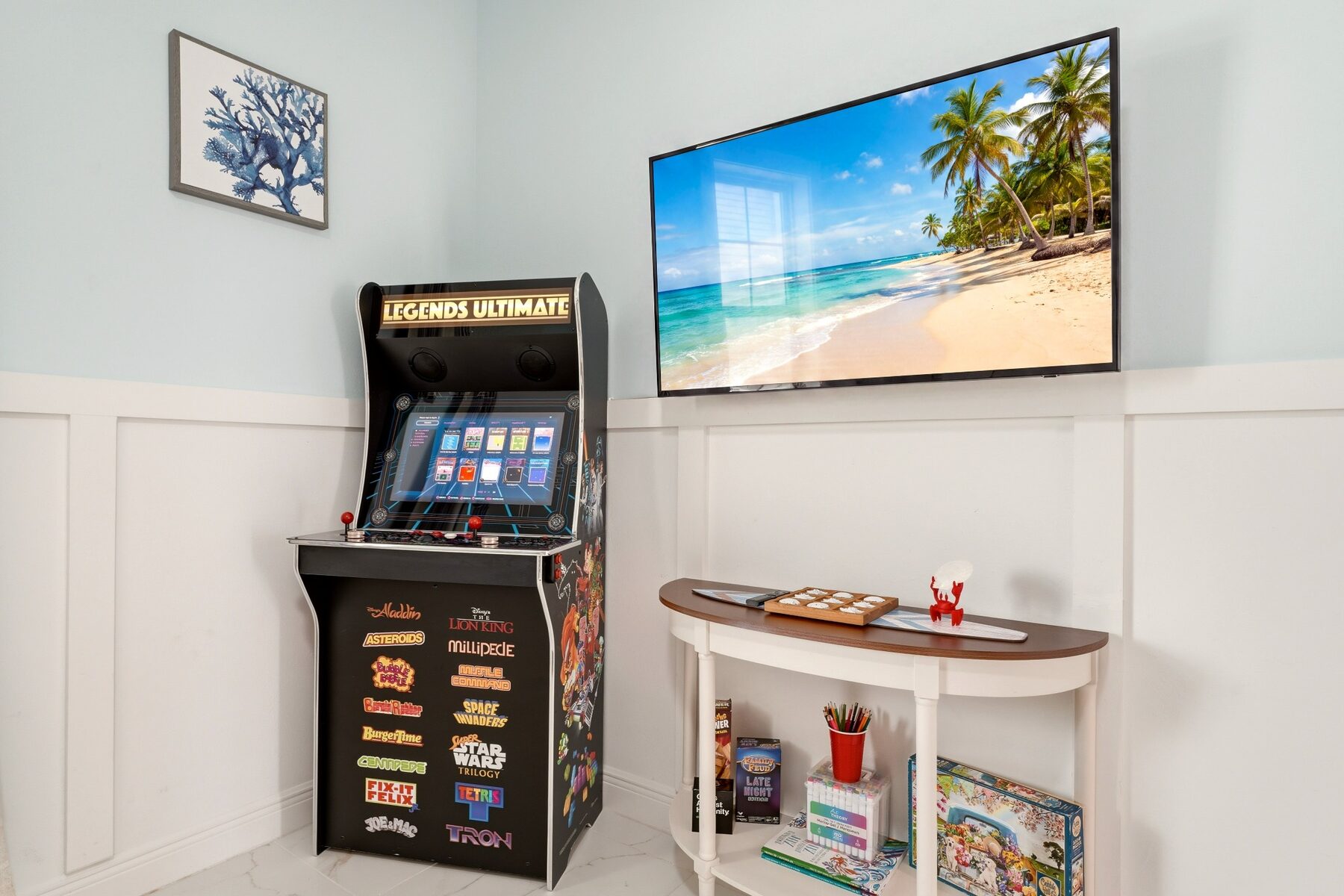 Arcade machine, television, games, and activity table